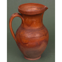 Ceramic pitcher with ornament