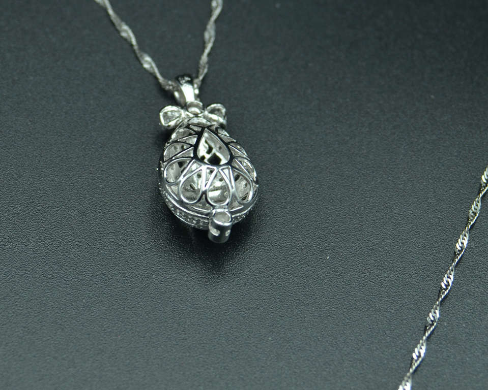 Faberge style white gold egg pendant with chain