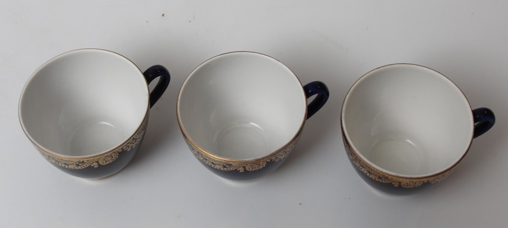 Three porcelain cups with saucers