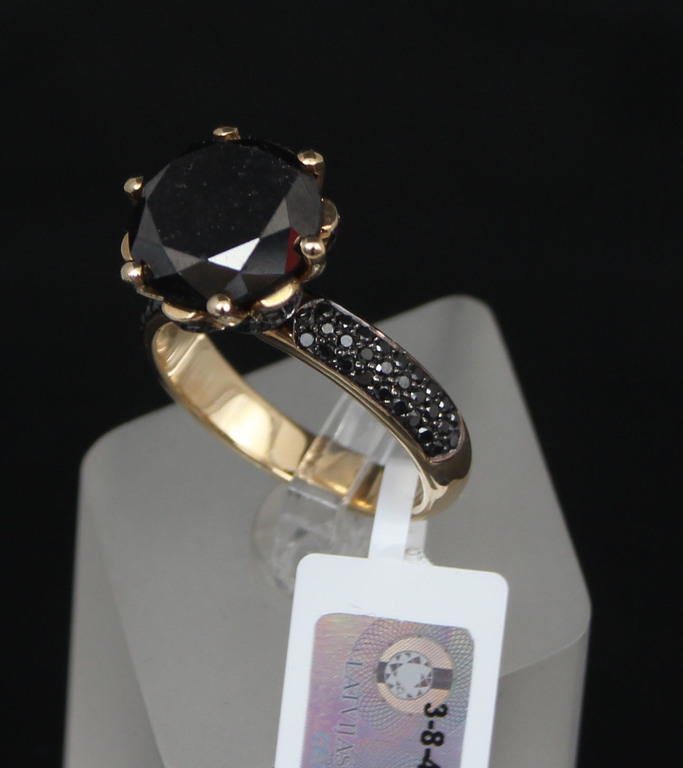 Gold ring with black diamonds