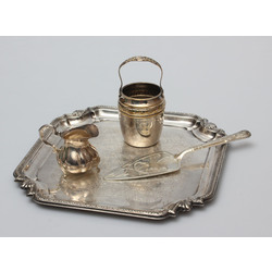 Metal tray, a cake showel, a cream container, and a dish