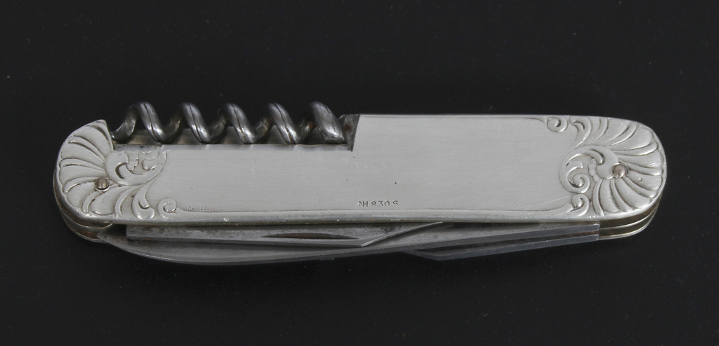 A knife with a silver case