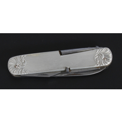 A knife with a silver case