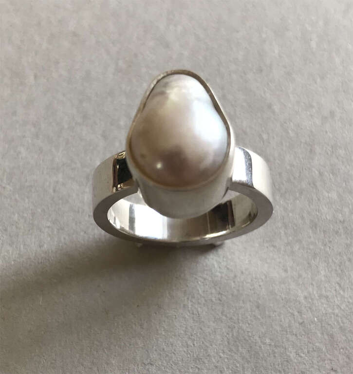 Silver ring with a pearl