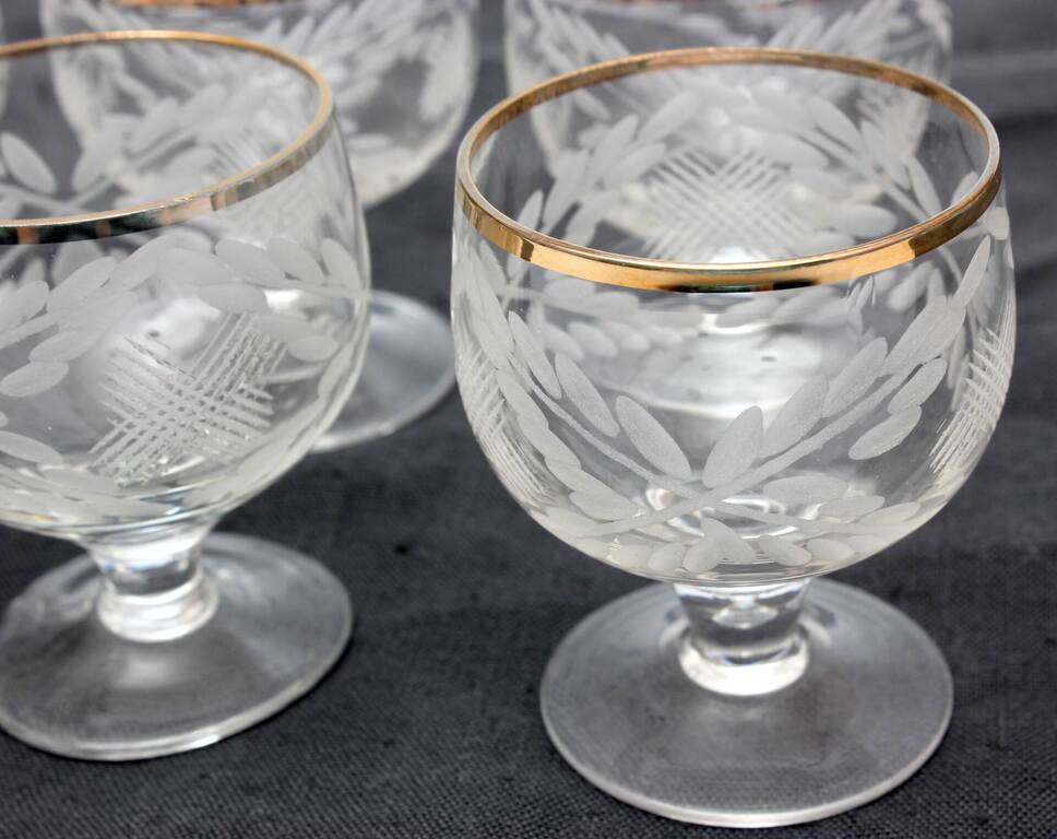 A set of glasses with an engraved ornament