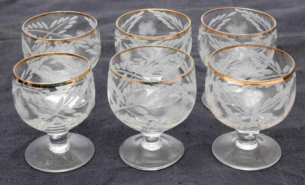 A set of glasses with an engraved ornament