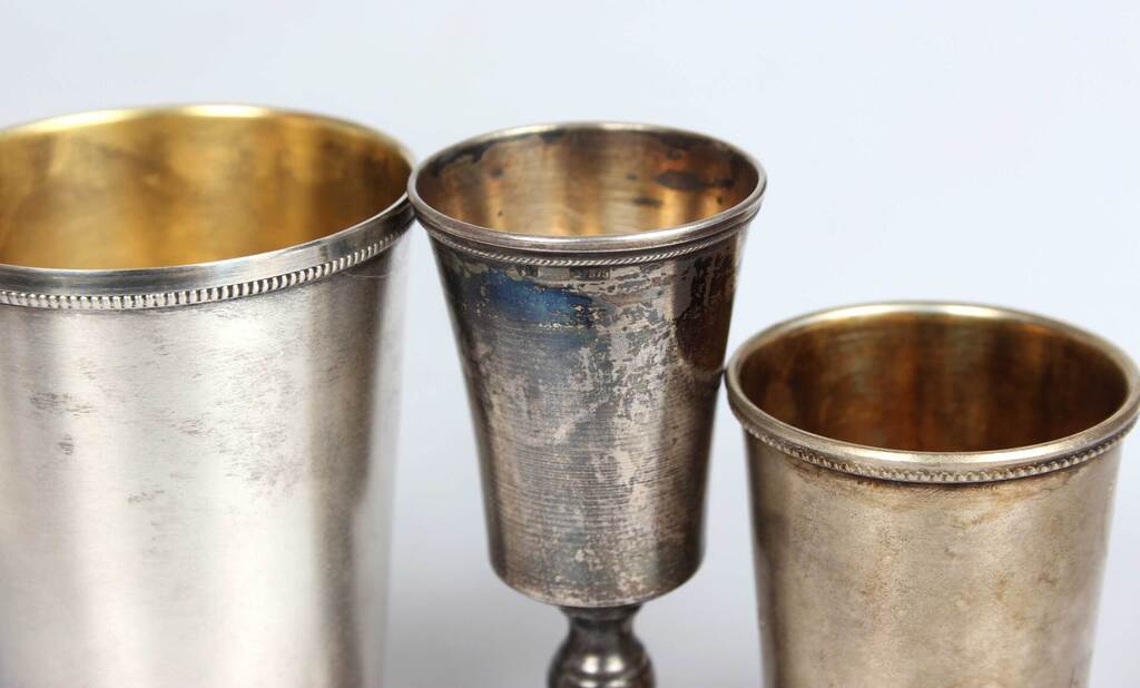 Three silver goblets