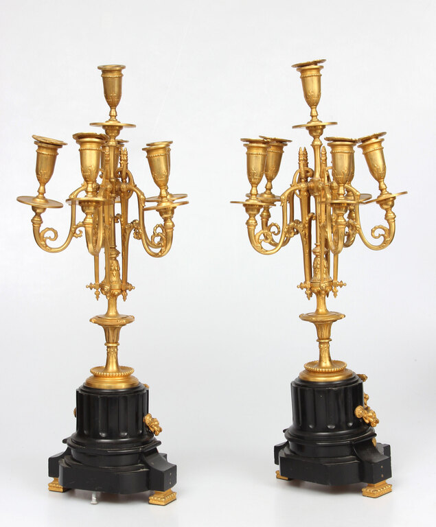 Bronze candlesticks with a stone base