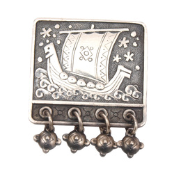 Silver brooch with sailing ship