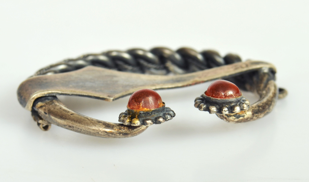 Silver brooch with fused amber
