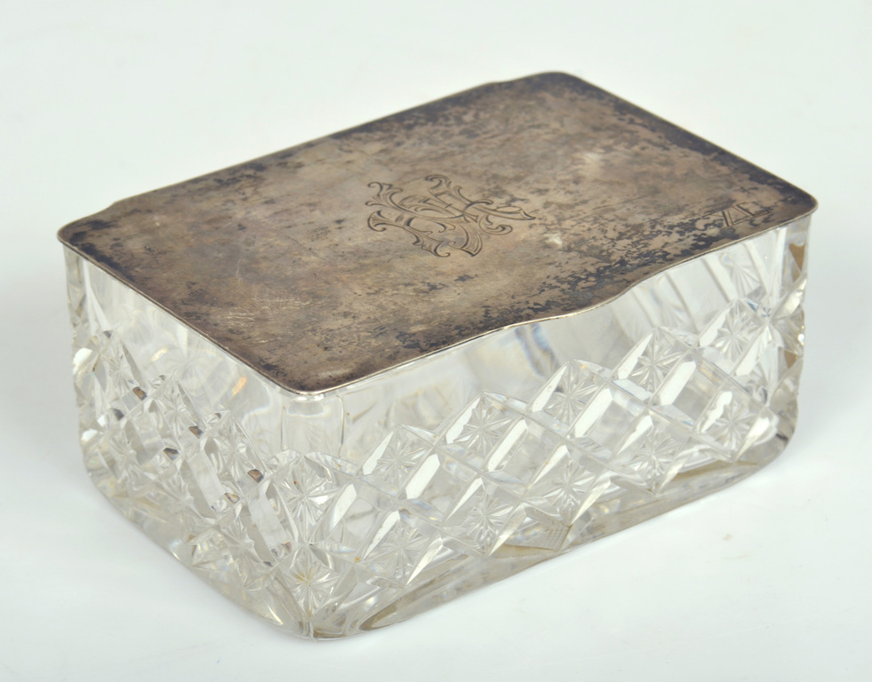 Glass casket with silver lid