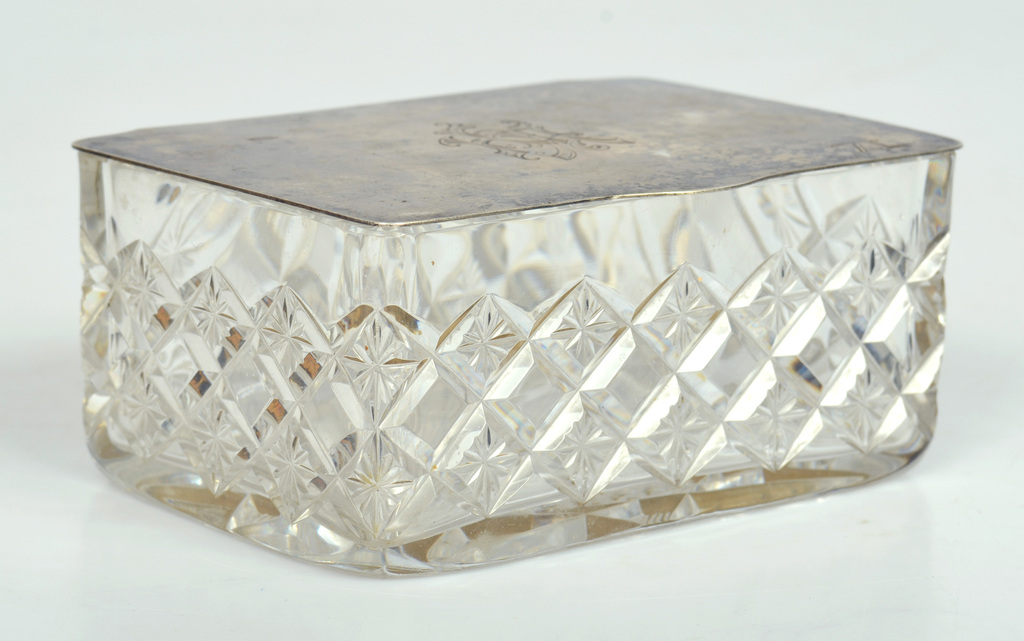 Glass casket with silver lid