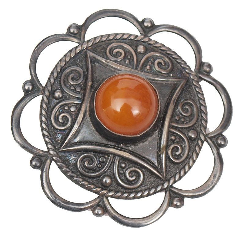 Silver brooch with amber