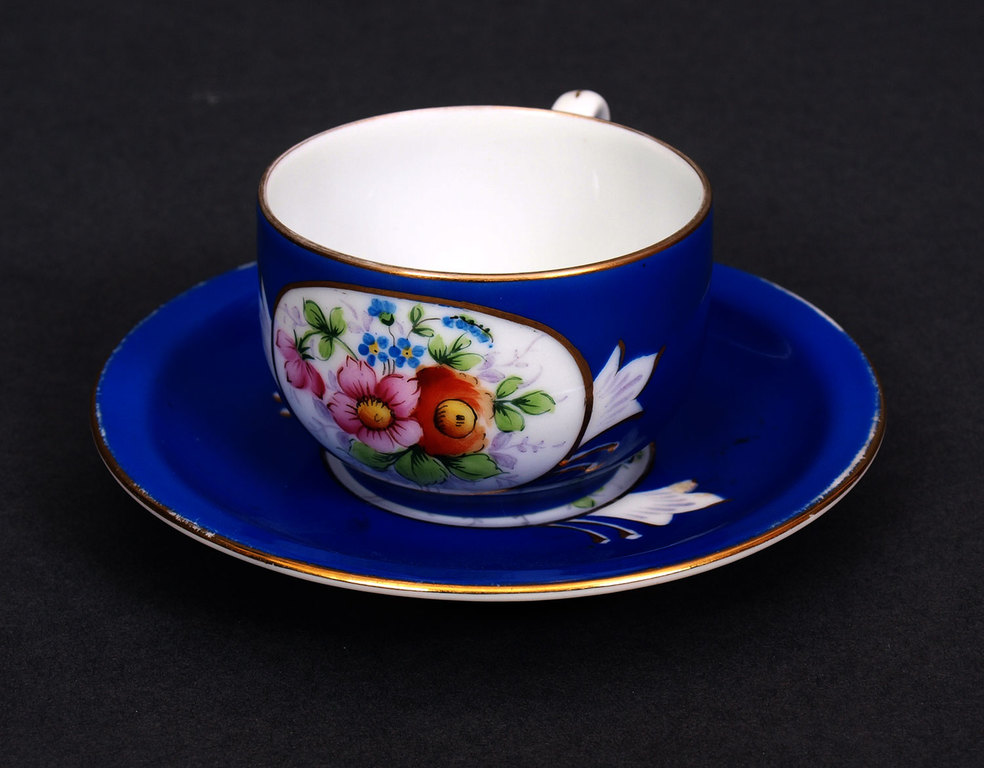 Porcelain cup with the saucer