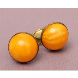 Metal cufflinks with amber imitation 