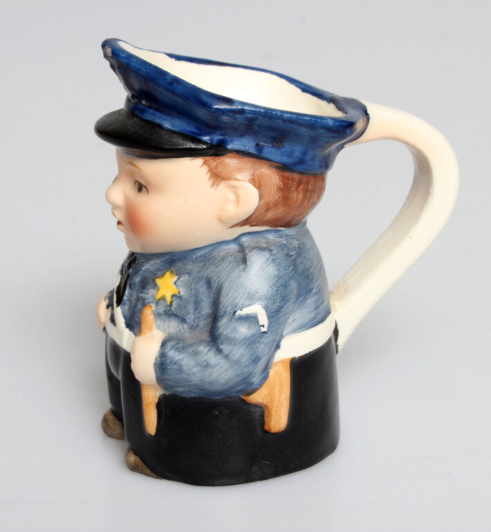 Porcelain cream can Policeman