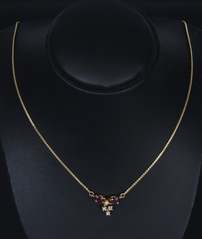 A gold necklace with diamonds and rubies?