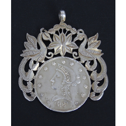 Silver pendant made from an 1881 silver 10 dollar coin
