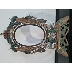 Metal frame with ornate heraldry