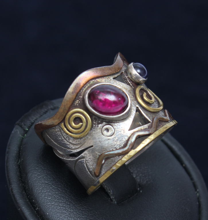 Silver ring with two colored stones