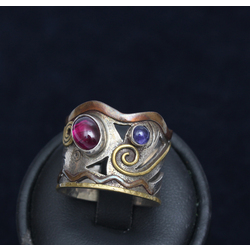 Silver ring with two colored stones