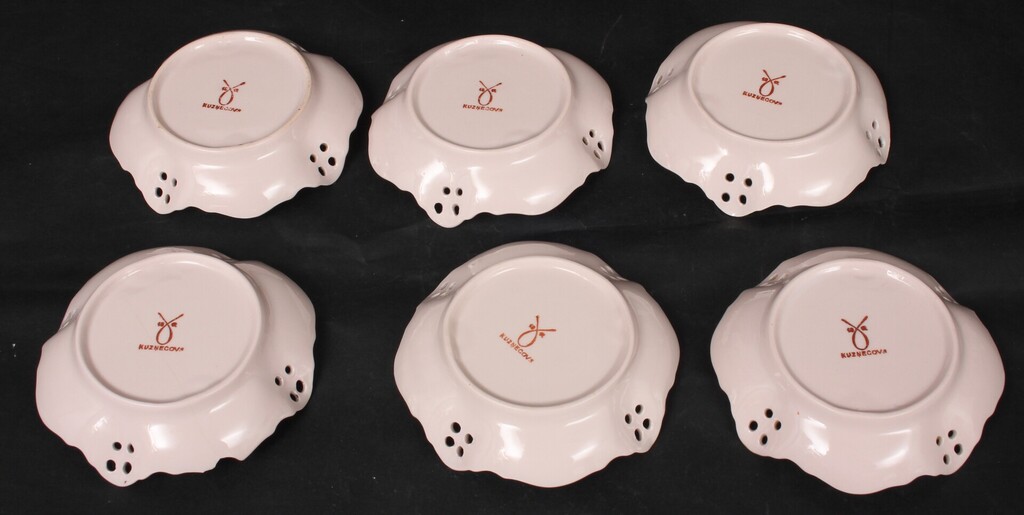 Painted porcelain serving plates (7 pcs.)