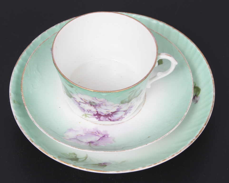 Painted porcelain cup with saucer