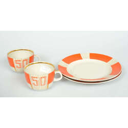 Porcelain tea cups and snack plates