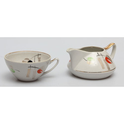 Porcelain coffee cup and creamer