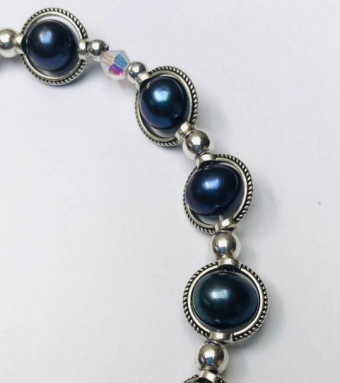 Blue Freshwater Pearl necklace with crystal and metal elements.