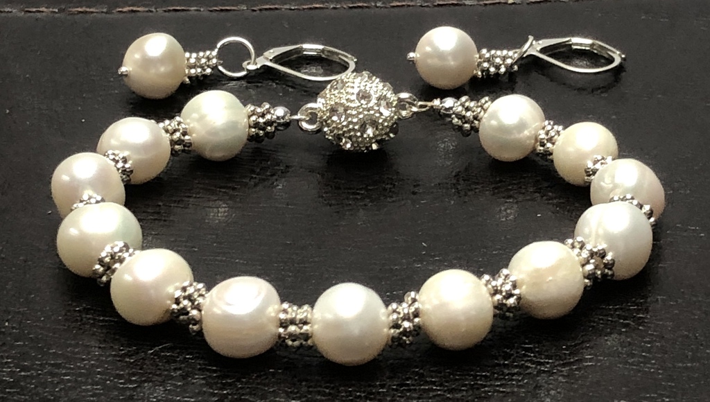 White freshwater pearl bracelet with earrings.