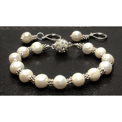 White freshwater pearl bracelet with earrings.