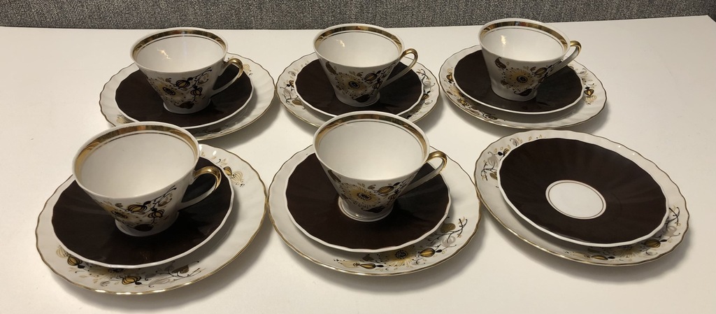 Five thin-walled porcelain trios (extra saucer and plate) from 