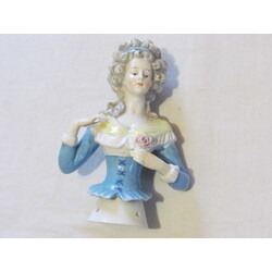 Porcelain figure from the warming cover of a kettle