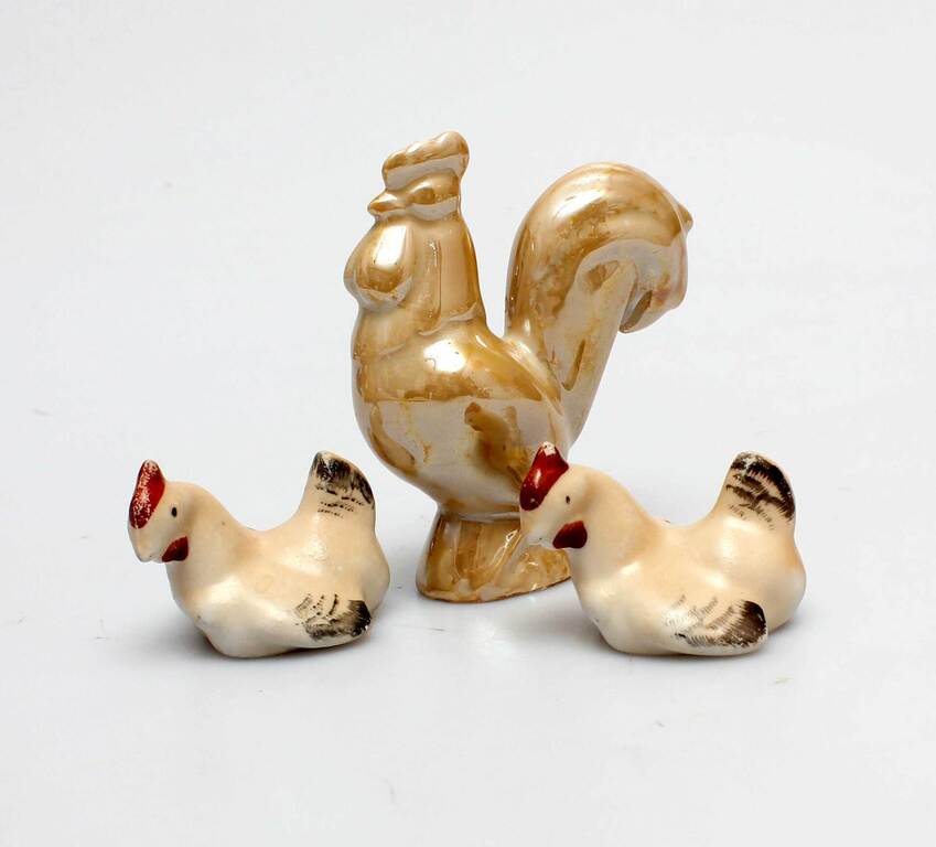 A rooster and two hens