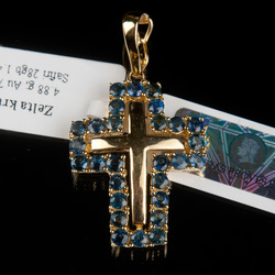 Golden cross with sapphires