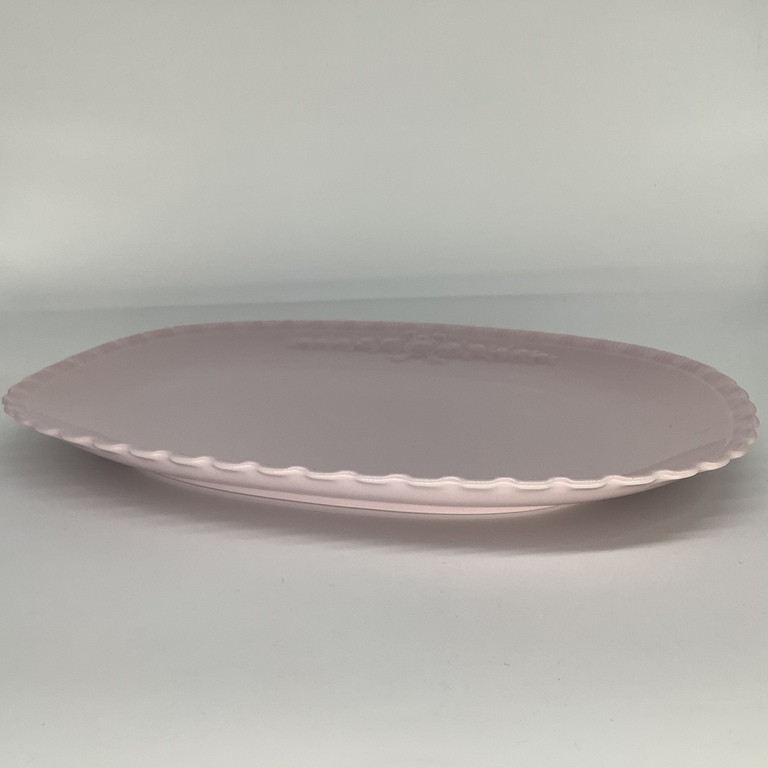 Large serving dish made of pink porcelain. Hünterreuther. Last century