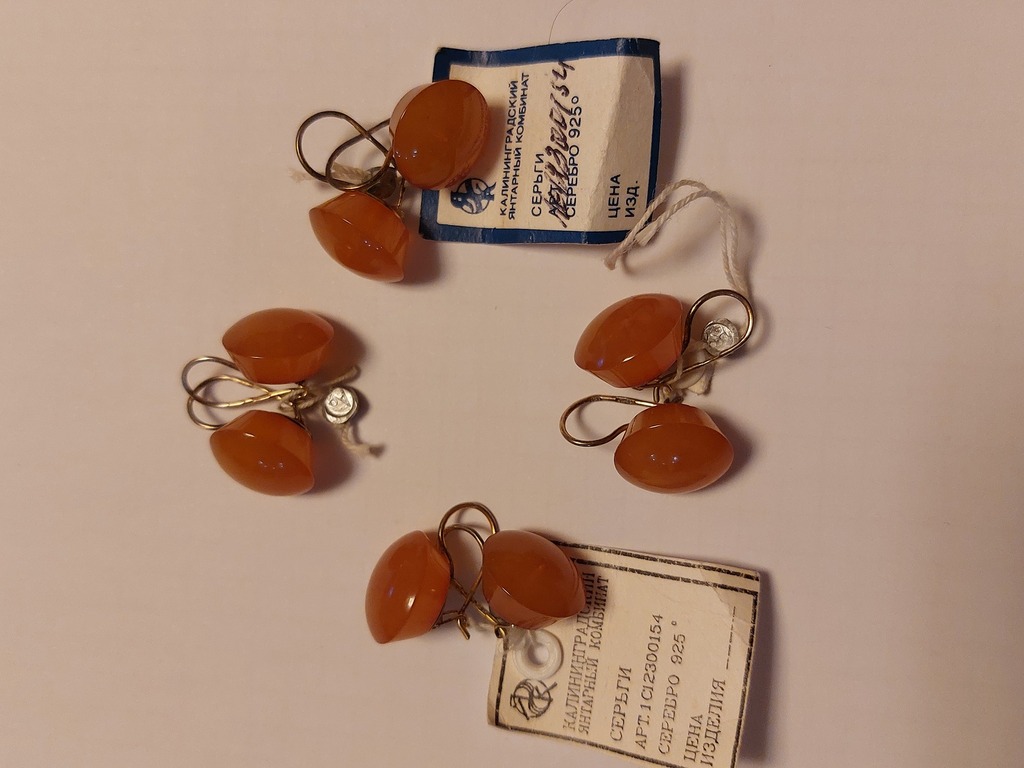 Four pairs of amber earrings. Gold-plated silver. Total weight 26 gr.