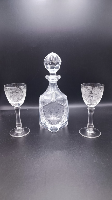 A very elegant small decanter with two glasses