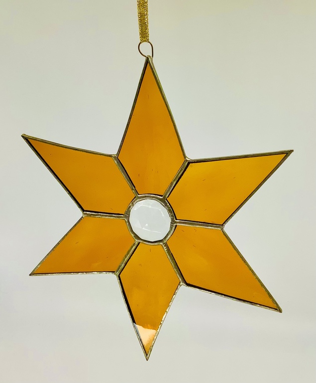 Natural stained glass. Christmas star. Ancient work of a Riga master. Christmas.