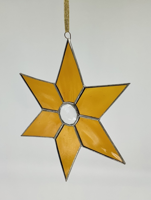 Natural stained glass. Christmas star. Ancient work of a Riga master. Christmas.