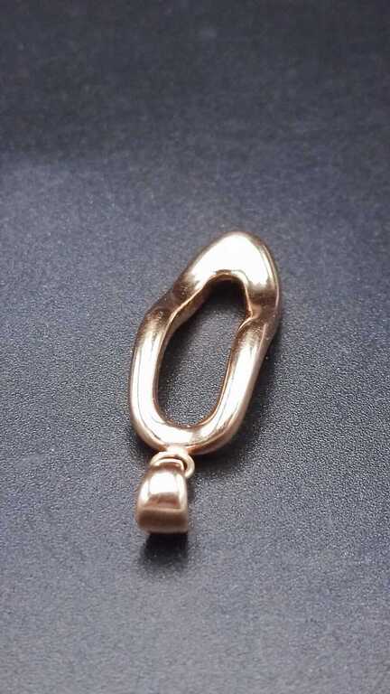 Gold pendant in the shape of a woman's shoe