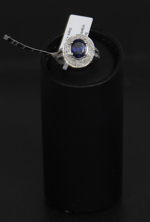 Gold ring set with 150 natural brilliants and 1 natural sapphire