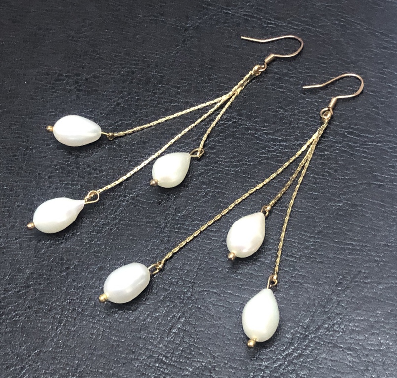 Silver earrings with gold plating and freshwater pearls.