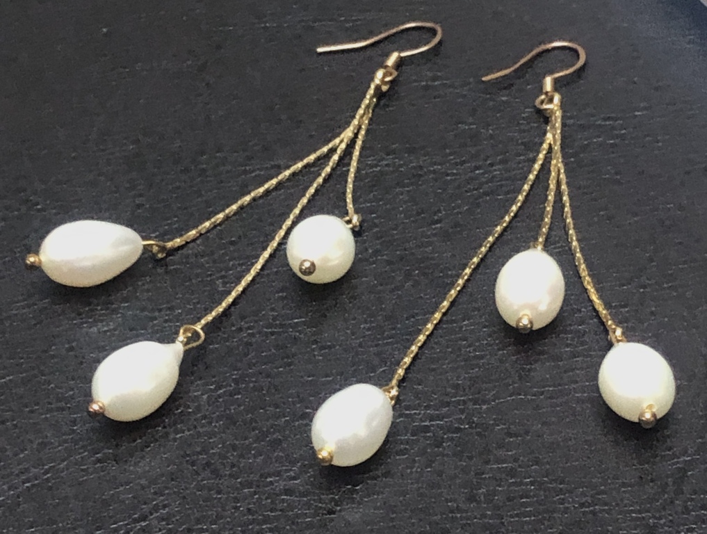 Silver earrings with gold plating and freshwater pearls.