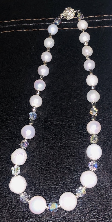 Necklace with white Edison freshwater pearls, Austrian crystals and a magnetic clasp with cubic zirconias.