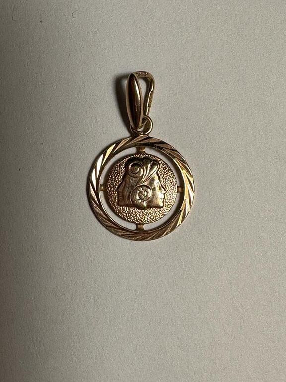 Gold pendant with the zodiac sign 