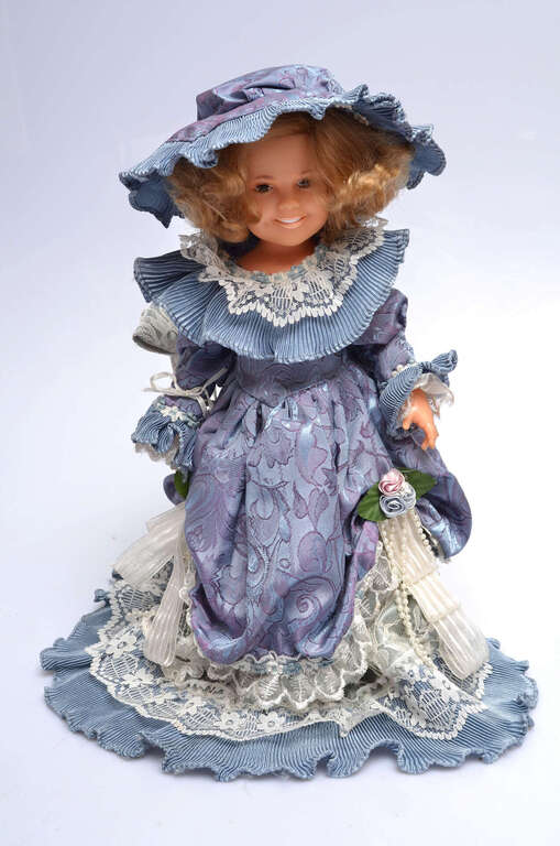 Vintage doll in a blue dress