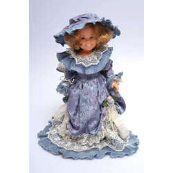 Vintage doll in a blue dress