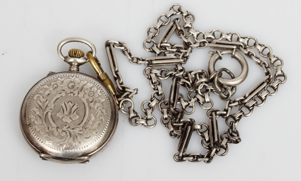 Silver pocket watch with chain